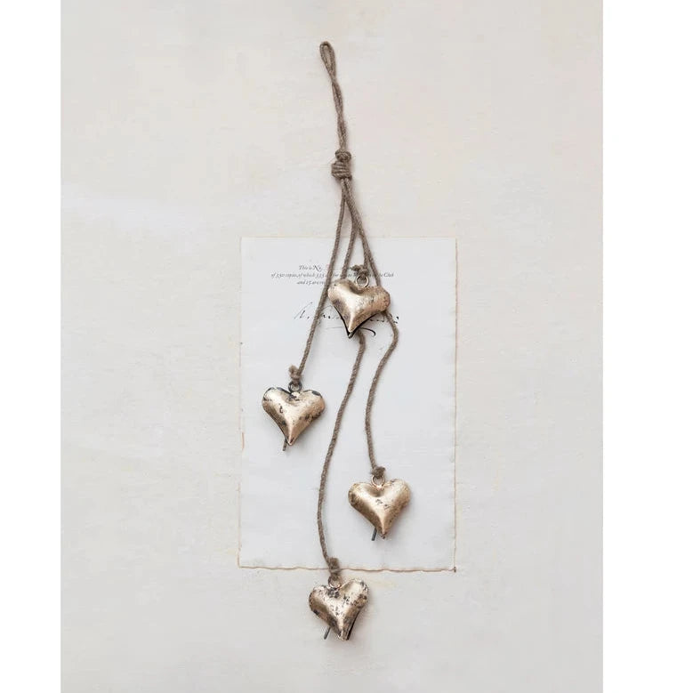 Decorative hanging heart ornament on a white background