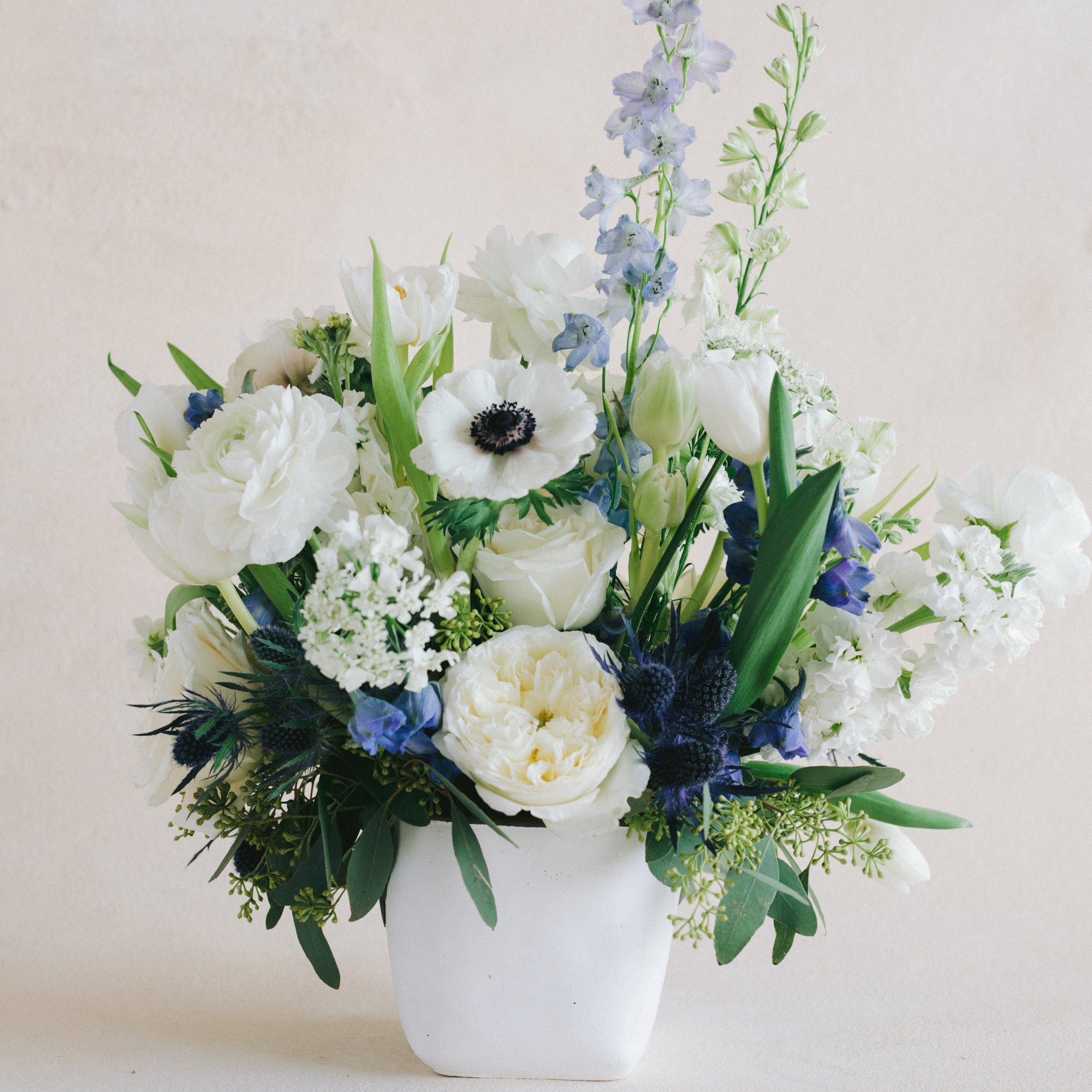 Blue and white floral vase arrangement 