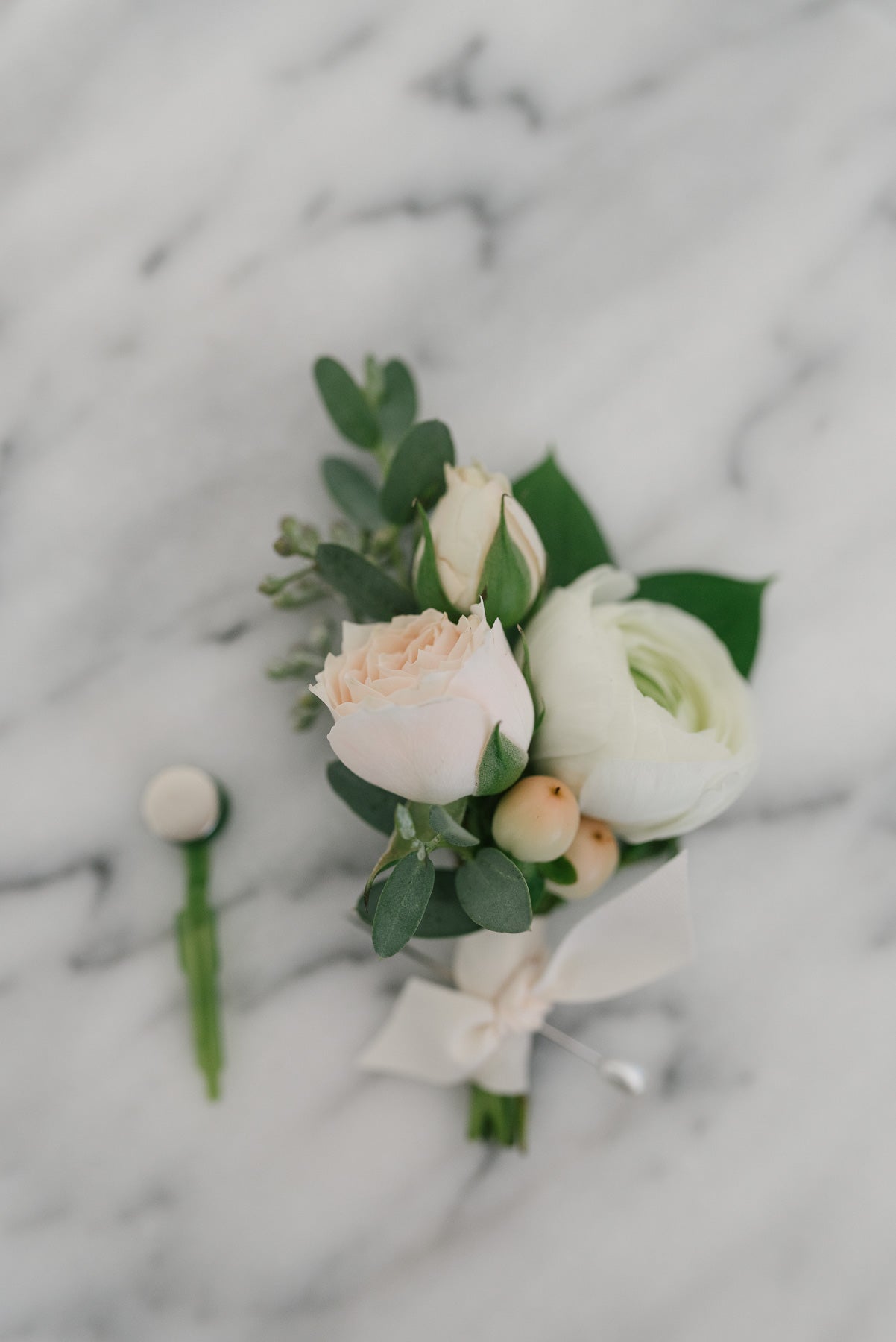 White and cream boutonnieres